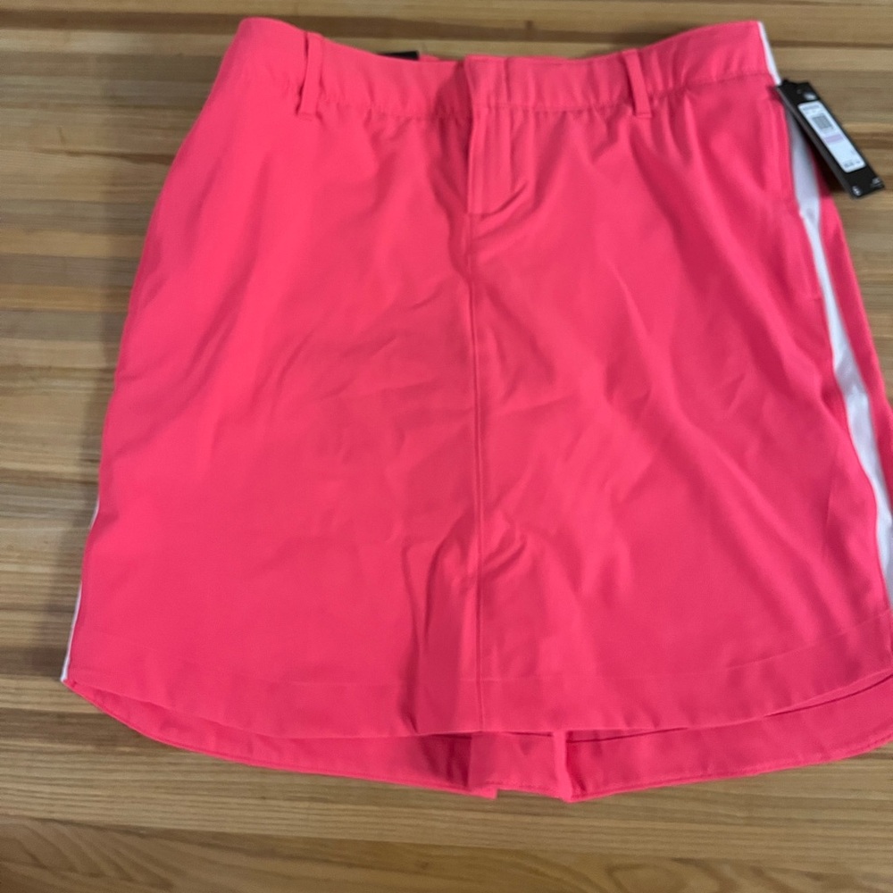 Hot pink Under armour golf skort size 6 brand new with tags.